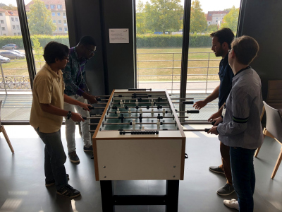 Who is working hard, also needs some time at the football table.