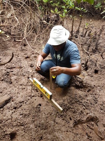 Amon taking elevation measurements (data)