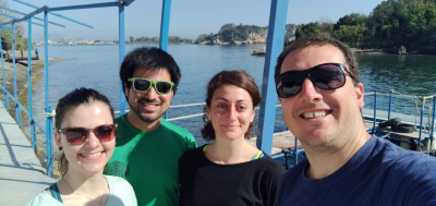 Four people looking into the camera