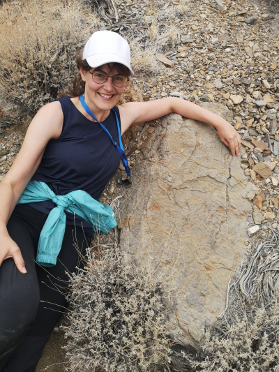 Janina in the field next to an outcrop