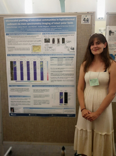 Janina Groninga standing next to her poster