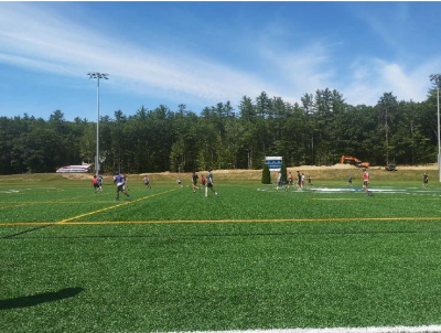 soccer pitch with people playing