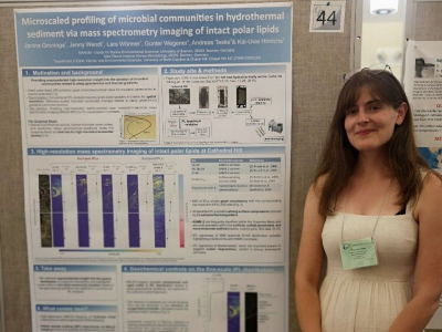 Janina Groninga standing next to her poster