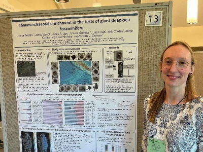 Janina Bösche standing next to her poster