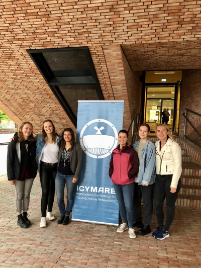 Selma and 5 of her colleagues next to an ICYMARE signpost