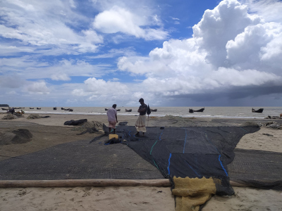 Fishers are mending nets for their next voyage