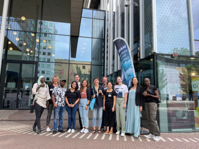 a group of people standing in front of a building
