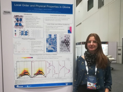 Christin next to her poster