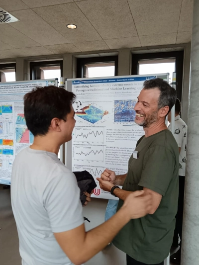 Figure showing Gastón presenting his poster