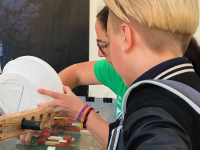 Alice demonstrates coastal protection with the flume