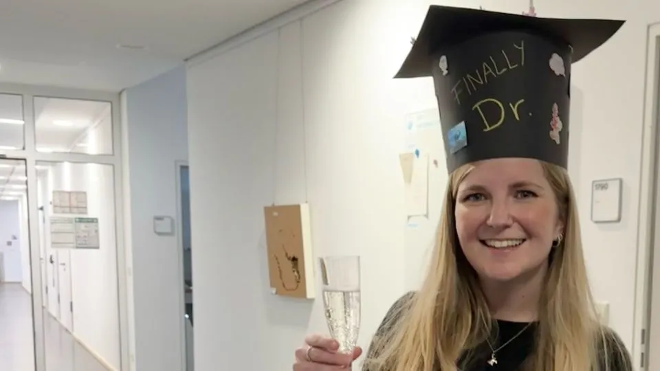 Claudia Hill with her doctoral hat