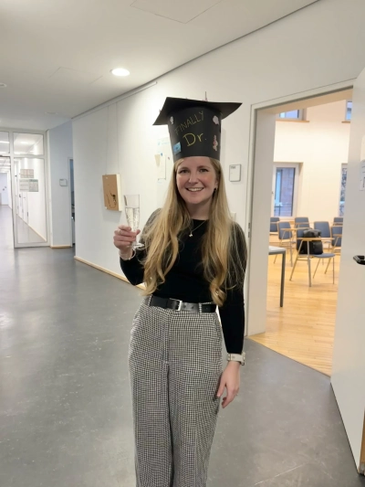 Claudia Hill with her doctoral hat