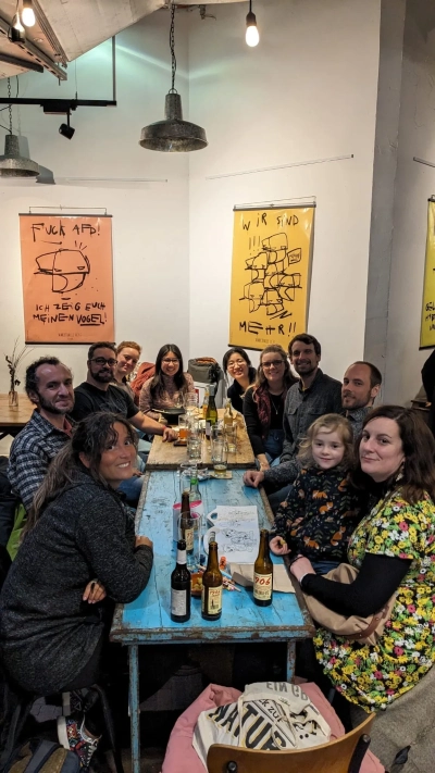 a group of people sitting around a table