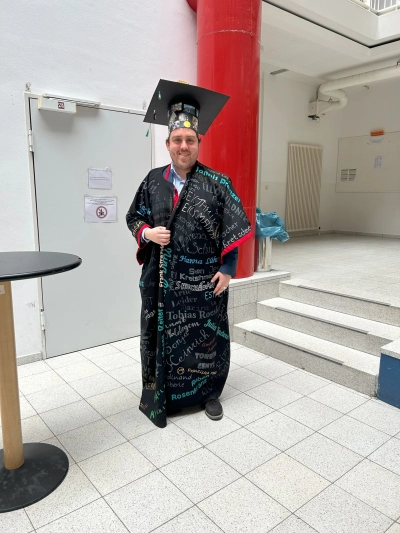 Andrés with his doctoral hat and gown