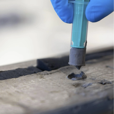 The figure shows sampling of a sediment core with a syringe.