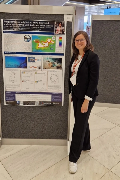 Eva-Maria Meckel next to her poster