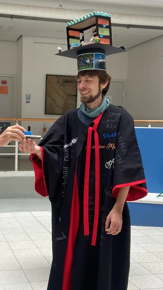 Adrian Höfken with his doctoral hat and cape