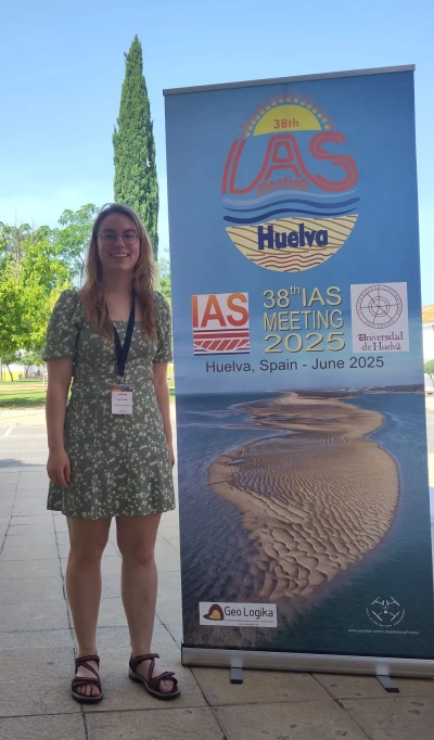 Anna Katharina Baltz next to the conference sign