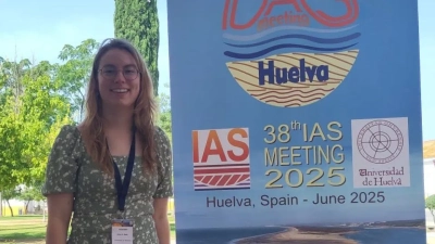 Anna Katharina Baltz next to the conference sign 