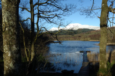 Snowcapped Highlands behind the small lake Dubh Lochan
